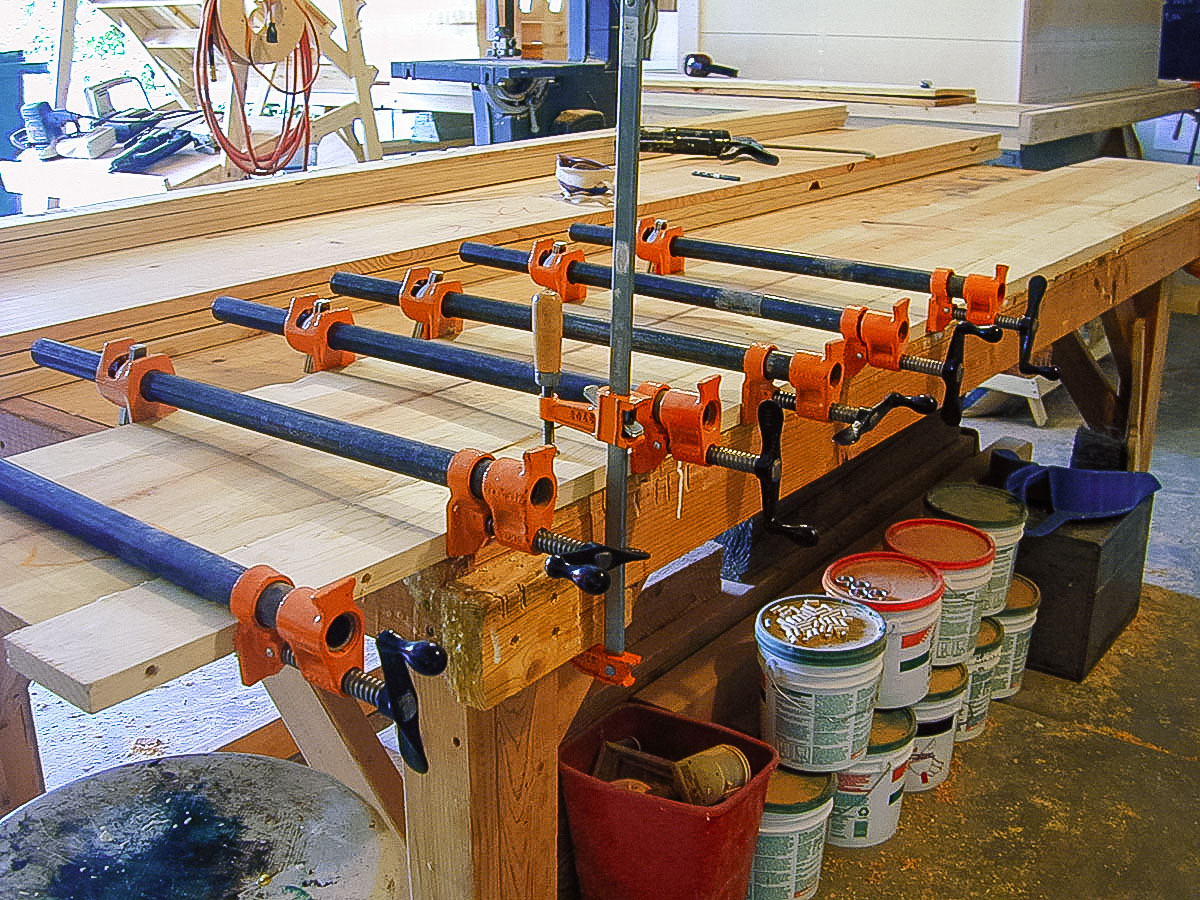 A 1x12 and a 1x4 are glued on the workbench.  The joint is reinforced with grabbers along ...