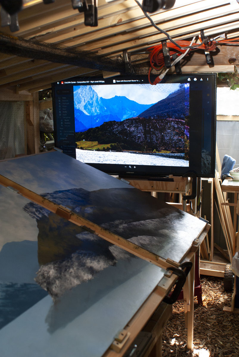 A large, flat-screen is mounted at the end of the drafting-table easel so that digital images can be...
