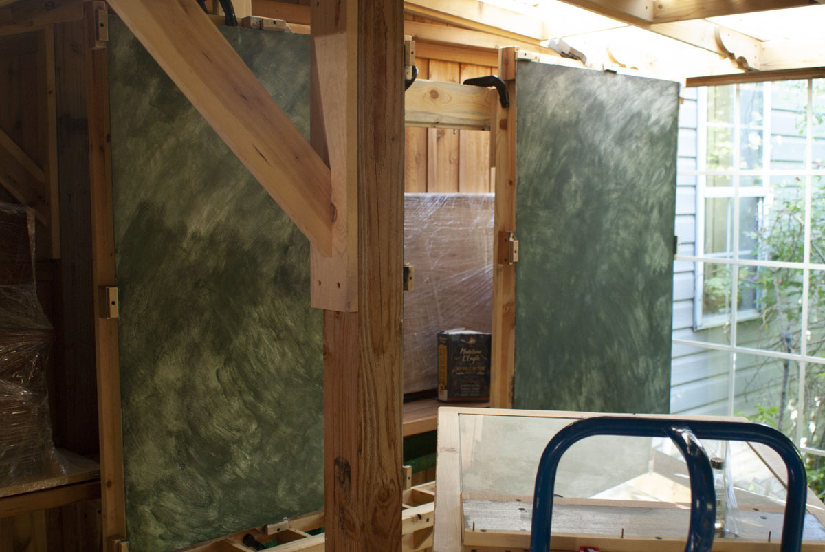 The left and right panels of the triptych were clamped to the easel in the old plein air area. ...