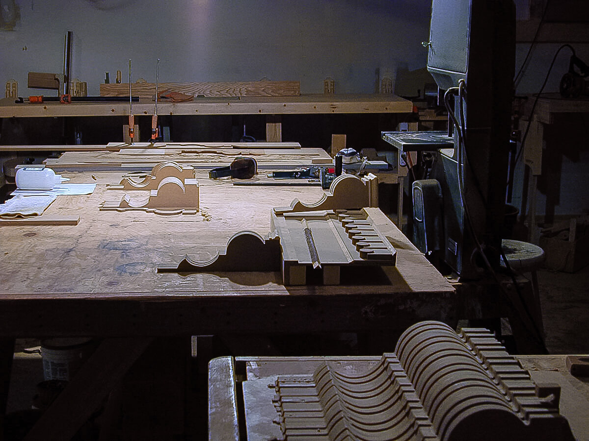 Corbels, designed by Al and routed by Ashton, are being glued in the shop.