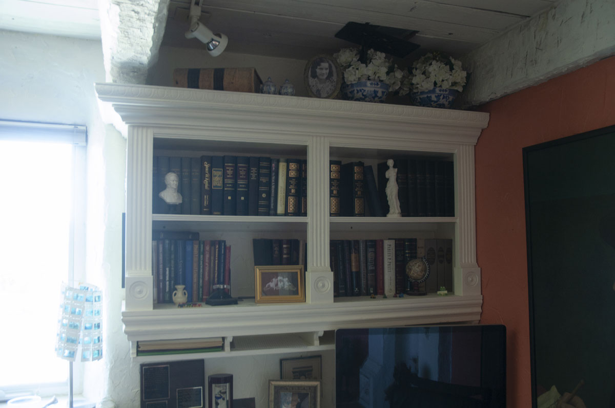 Wall-mounted bookcases were also designed by Al and created for the project.