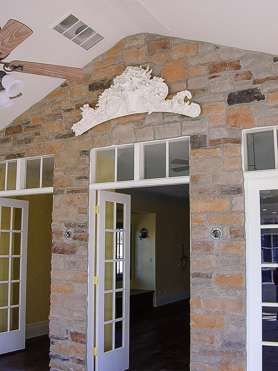 Ashton designed and created this botanical, bas relief sculpture hanging above the entrance to the s...