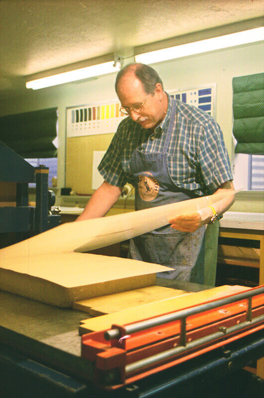 After the printing paper is in place on the stone, a sheet of newsprint is placed on top of it.&nbsp...