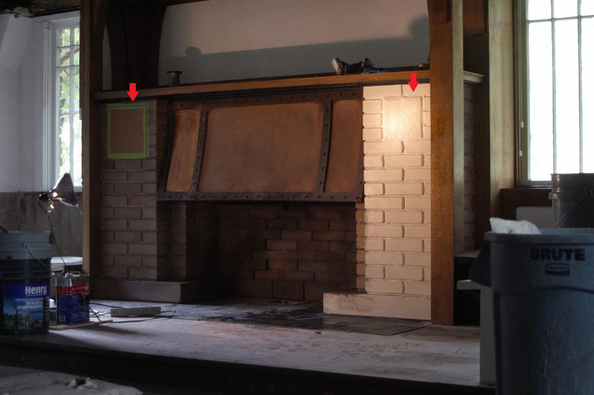 This process shot shows the left half of the fireplace stripped of paint.&nbsp;&nbsp;The left arrow ...