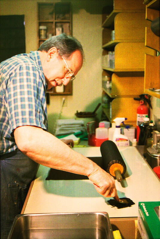 The leather roller is inked on the ink slab.&nbsp;&nbsp;Three ribbons of ink are applied to the slab...